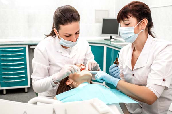 West Vancouver dentist cleaning patients teeth